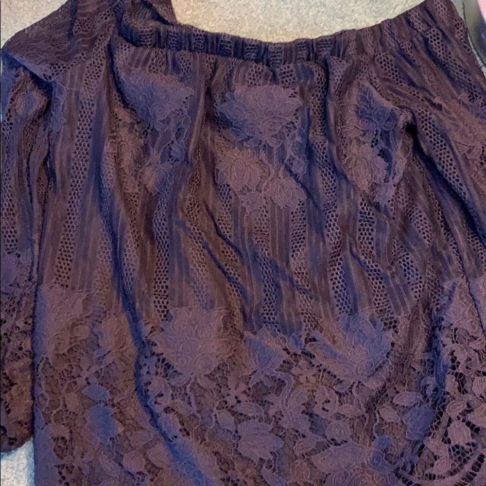 black shirt with a flower design